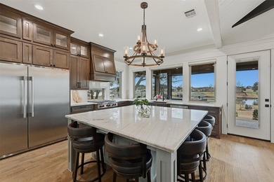 Welcome to refined lakeside living in the prestigious gated - photo 17