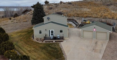 This well-maintained lake home has been totally remodeled with - photo 3