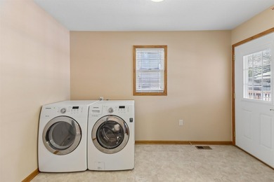 Welcome to this all-brick ranch home! The bright sunny living - photo 15