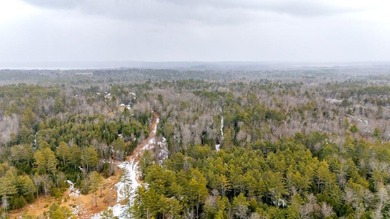 Tucked away in the heart of Maine's lake country, this raw - photo 8