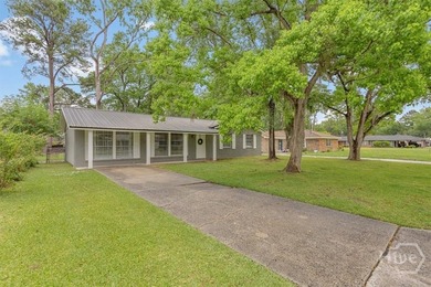 New Price! Welcome home to this beautifully renovated all-brick - photo 3