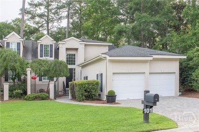 An exceptional townhome nestled within the gated enclave of - photo 1