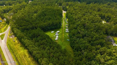 Approximately 1.98-acre wooded homesite located in the gated - photo 1