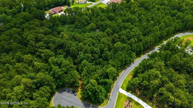 Approximately 1.98-acre wooded homesite located in the gated - photo 2