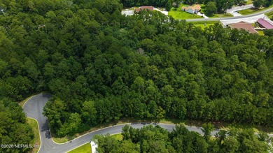 Approximately 1.98-acre wooded homesite located in the gated - photo 3
