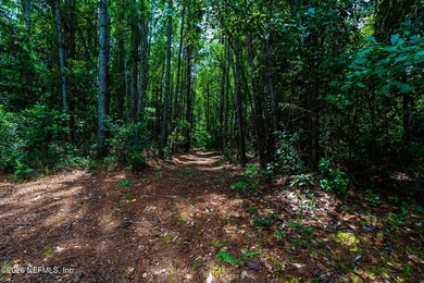Approximately 1.98-acre wooded homesite located in the gated - photo 7