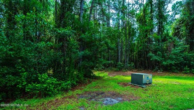 Approximately 1.98-acre wooded homesite located in the gated - photo 8