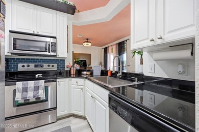 Beautifully updated 2 bedroom, 1 bath two-story corner unit - photo 10