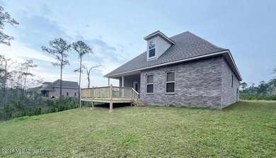 This stunning brick home immediately catches the eye with its - photo 2