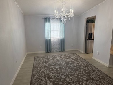 Entrance to this 2 bath 2-bedroom home is well under the car - photo 22