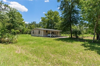 Discover the potential of this 2.14-acre corner lot property in - photo 1