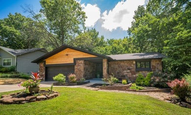 Totally remodeled - new roof, flooring, paint, appliances - photo 1
