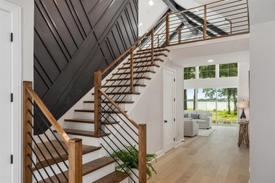 This modern farmhouse mini mansion on the water is truly a - photo 2
