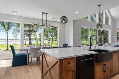 This modern farmhouse mini mansion on the water is truly a - photo 8