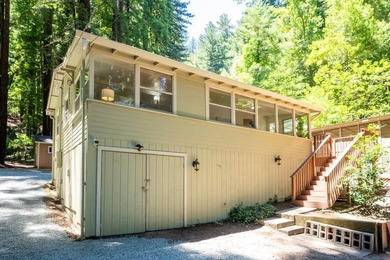 Nestled beneath a canopy of majestic redwood trees on a spacious - photo 2