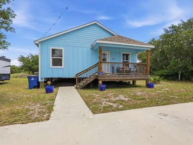Built in 2021, this 3-bedroom, 2-bath coastal cottage sits on - photo 2