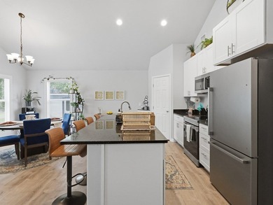 Built in 2021, this 3-bedroom, 2-bath coastal cottage sits on - photo 9