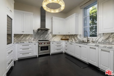 Perched at the pinnacle of Crystal Cove on a rare, single-loaded