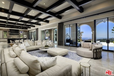 Perched at the pinnacle of Crystal Cove on a rare, single-loaded