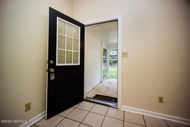 Cute house sits up high from street. Large screened porch, 1 car - photo 10