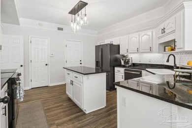 Fully renovated and move-in ready! Nestled within a serene gated - photo 14