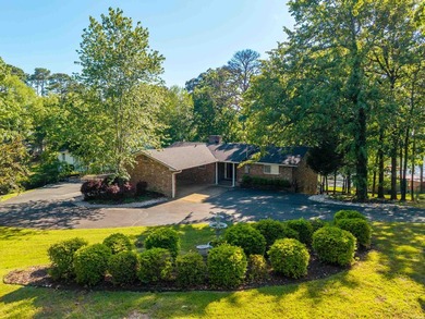 Tucked away on a large 1-acre waterfront lot, this fully - photo 1