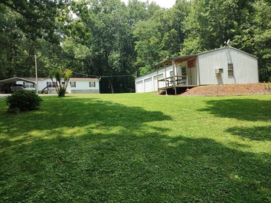 Located just minutes from Paris Landing State Park and Kentucky - photo 2