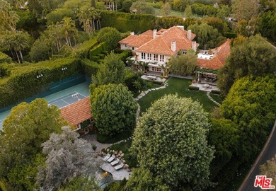Hidden behind layers of mature landscaping and approached - photo 1