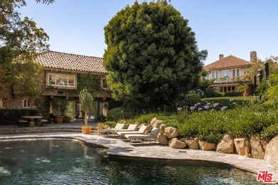 Hidden behind layers of mature landscaping and approached - photo 3