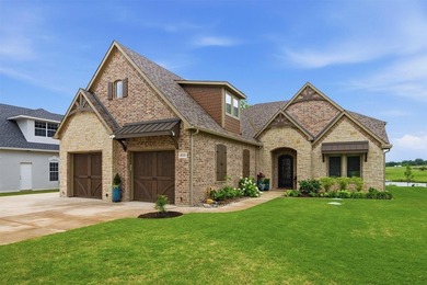 Welcome to refined lakeside living in the prestigious gated - photo 1
