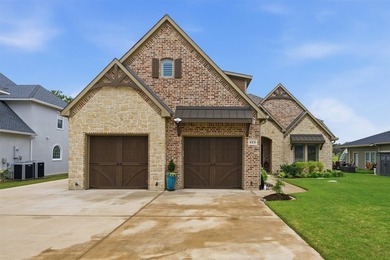 Welcome to refined lakeside living in the prestigious gated - photo 2