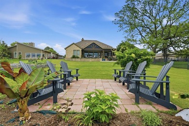 Welcome to refined lakeside living in the prestigious gated - photo 3