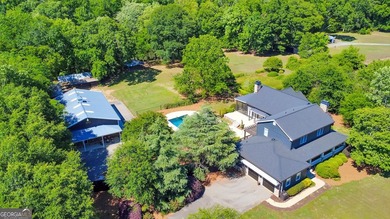 Experience a rare blend of privacy, acreage, and riverfront - photo 2