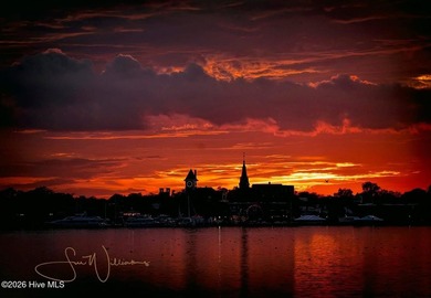 Where the river meets the sky in a wash of gold and crimson - photo 2