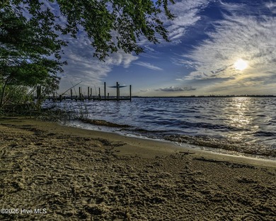 Where the river meets the sky in a wash of gold and crimson - photo 10