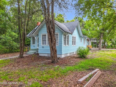 Welcome home to this charming cottage-style gem situated on a - photo 2