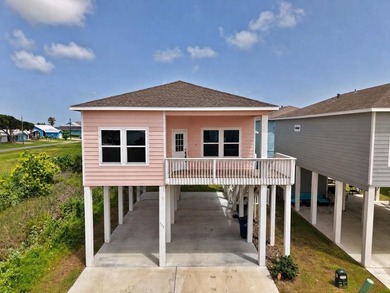 Coastal charm meets breezy living in this eye-catching pink - photo 1