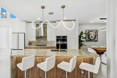 A striking, newly renovated two-story residence showcasing - photo 2