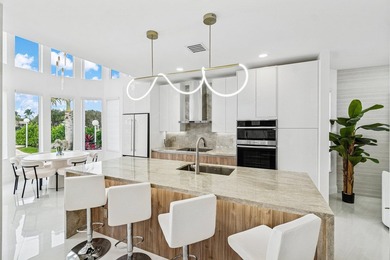 A striking, newly renovated two-story residence showcasing - photo 3
