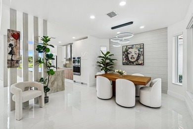 A striking, newly renovated two-story residence showcasing - photo 9