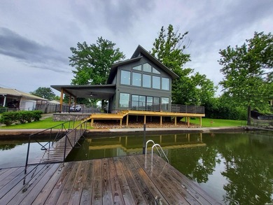 Lakefront living at its best is complete in this beautifully - photo 2