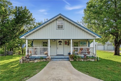 Positioned on 5.14 acres in a scenic Ozark Mountain setting near - photo 1