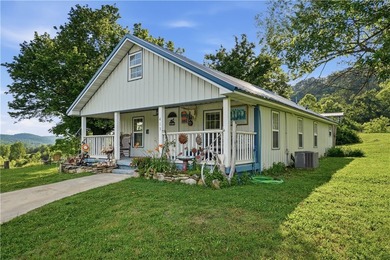 Positioned on 5.14 acres in a scenic Ozark Mountain setting near - photo 2