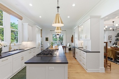 This elevated waterfront home with a private dock has been - photo 23