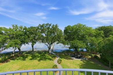 This elevated waterfront home with a private dock has been - photo 34