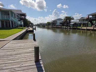 Canal-front living begins here in the sought-after Holiday Beach - photo 1