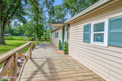 Warm, welcoming, and thoughtfully updated, this charming - photo 3