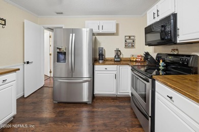 Warm, welcoming, and thoughtfully updated, this charming - photo 8