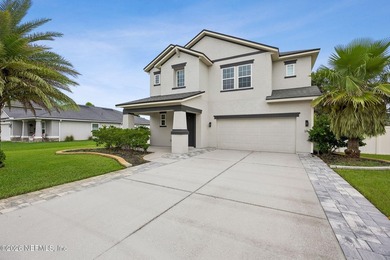 Perfectly positioned on a massive corner lot in the highly - photo 3