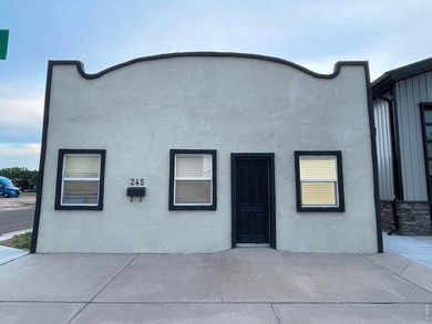 Step into a beautifully renovated 728 sq ft office building that - photo 1